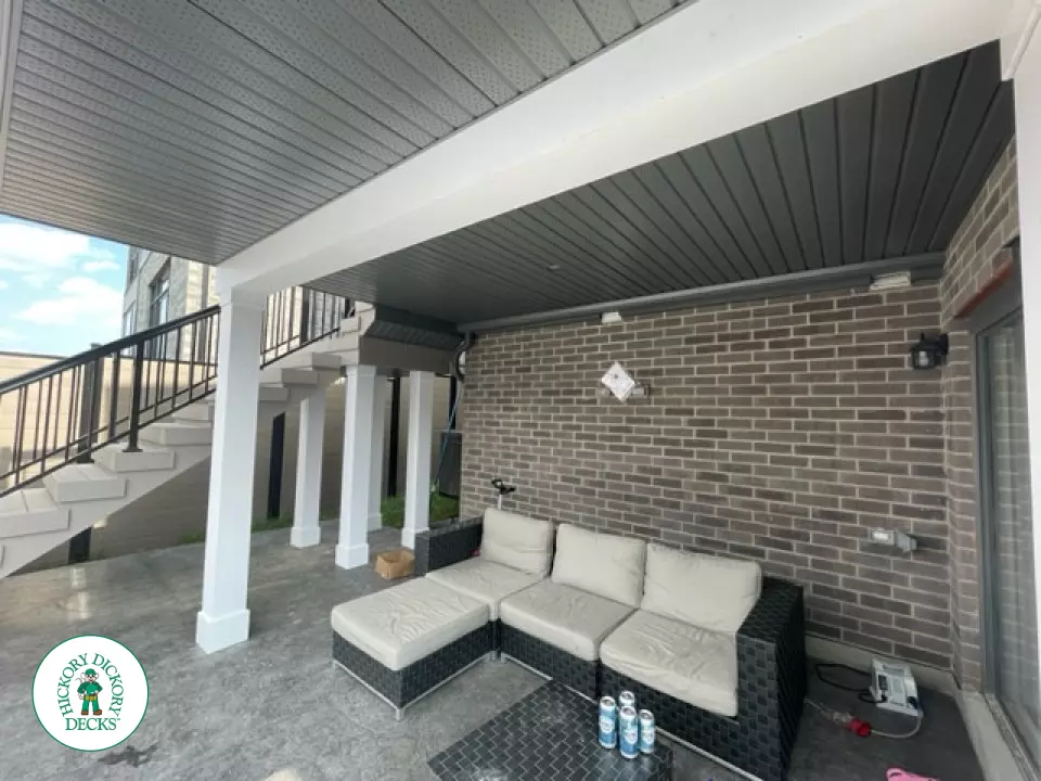 High grey composite deck with glass style railings.