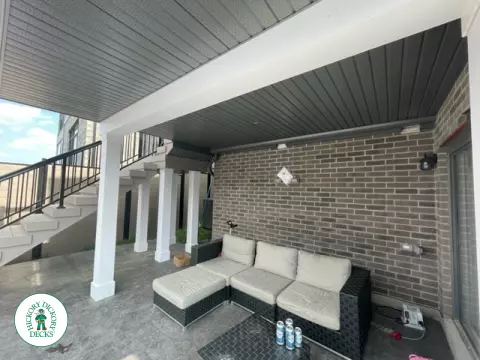 High grey composite deck with glass style railings.