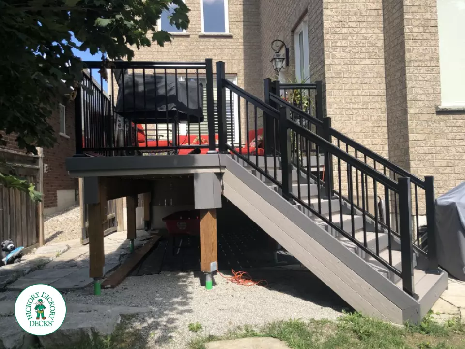 Azek deck with aluminum railing and lights in stairs in Innisfil