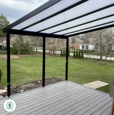 Clubhouse deck with aluminum railings, lights and custom roof in London Ontario