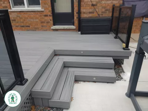 Fiberon low deck with glass railings in Welland