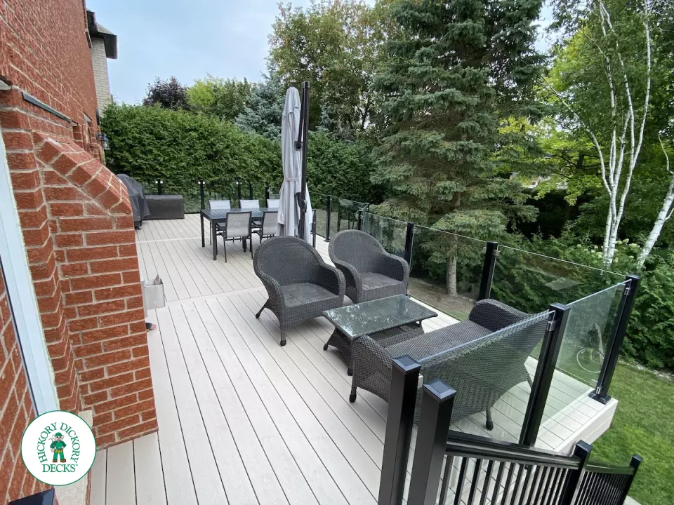 High Deck with stairs in Clay composite with glass railings.