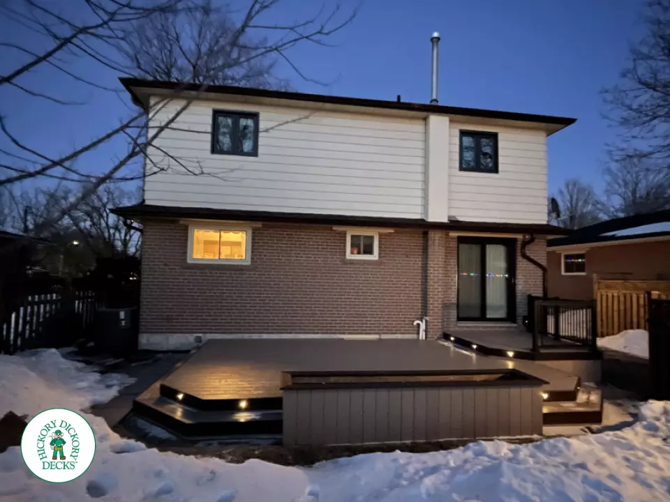 Brown clubhouse deck with lighting in steps.