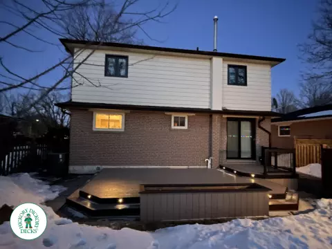 Brown clubhouse deck with lighting in steps.