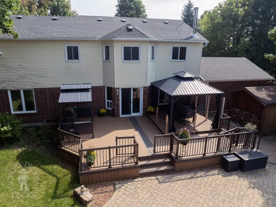Clubhouse deck with aluminum railing with gate insert for access.