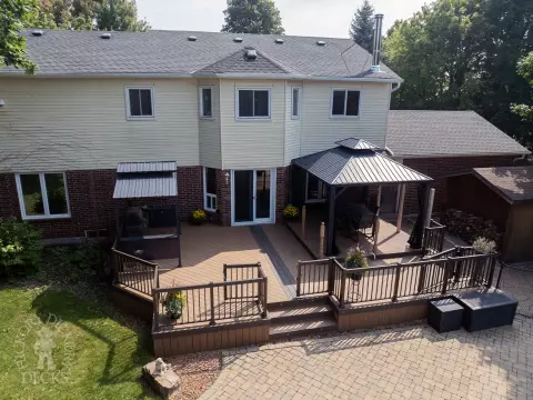 Clubhouse deck with aluminum railing with gate insert for access.