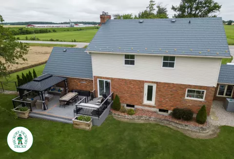 Grey TruNorth deck with brown borders and aluminum railing.
