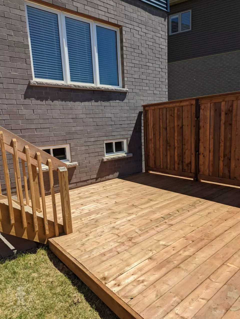 Pressure treated deck with pressure treated privacy screens and fence.