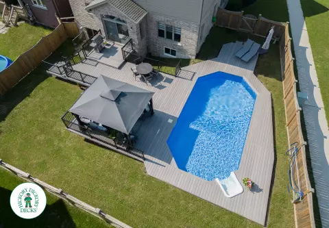 1000 square foot composite pool deck in grey shade.