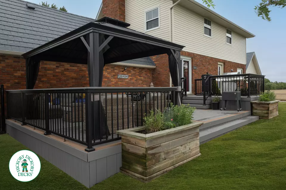 Grey TruNorth deck with brown borders and aluminum railing.