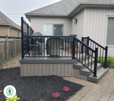 Clubhouse deck with privacy screens and lights in St. Catharines