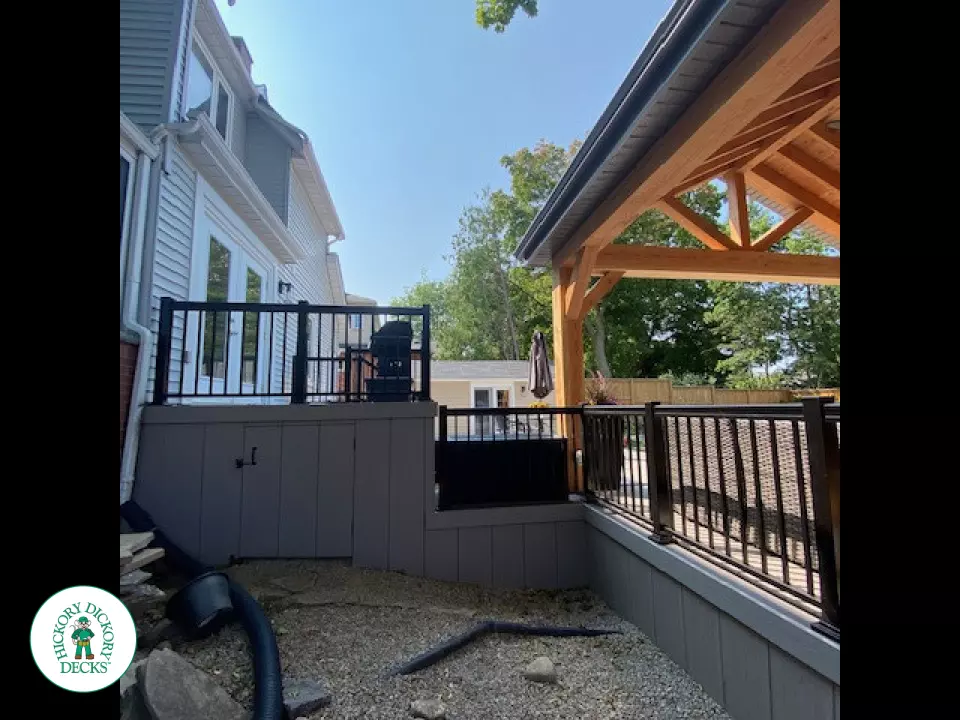 Large Azek deck with unique stairs and a cedar pavilion for shade.