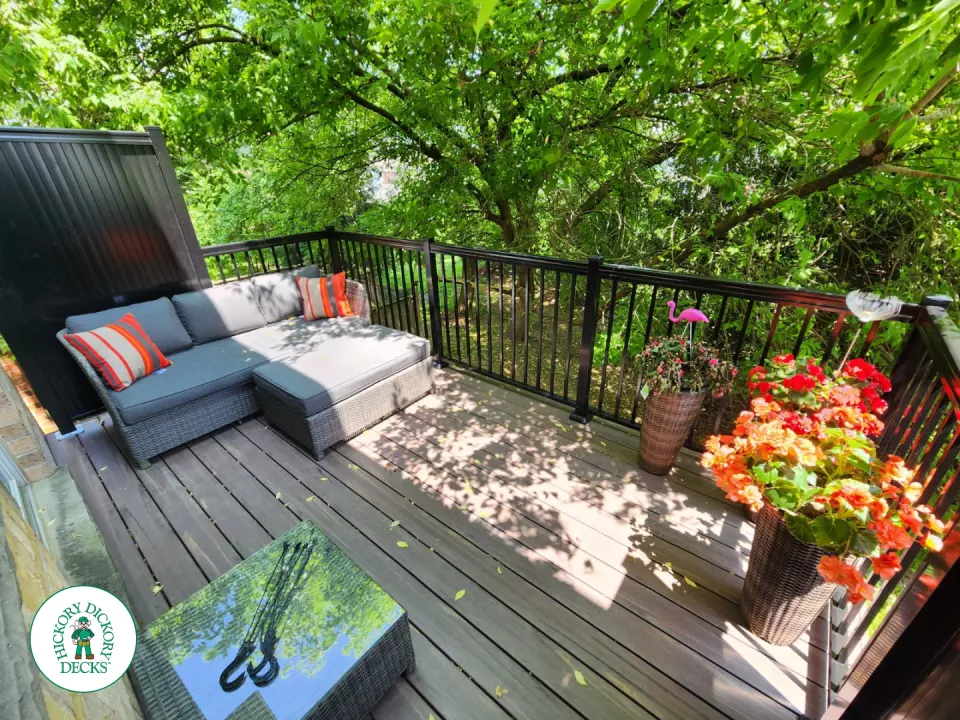 High brown Armadillo balcony with black aluminum railing.