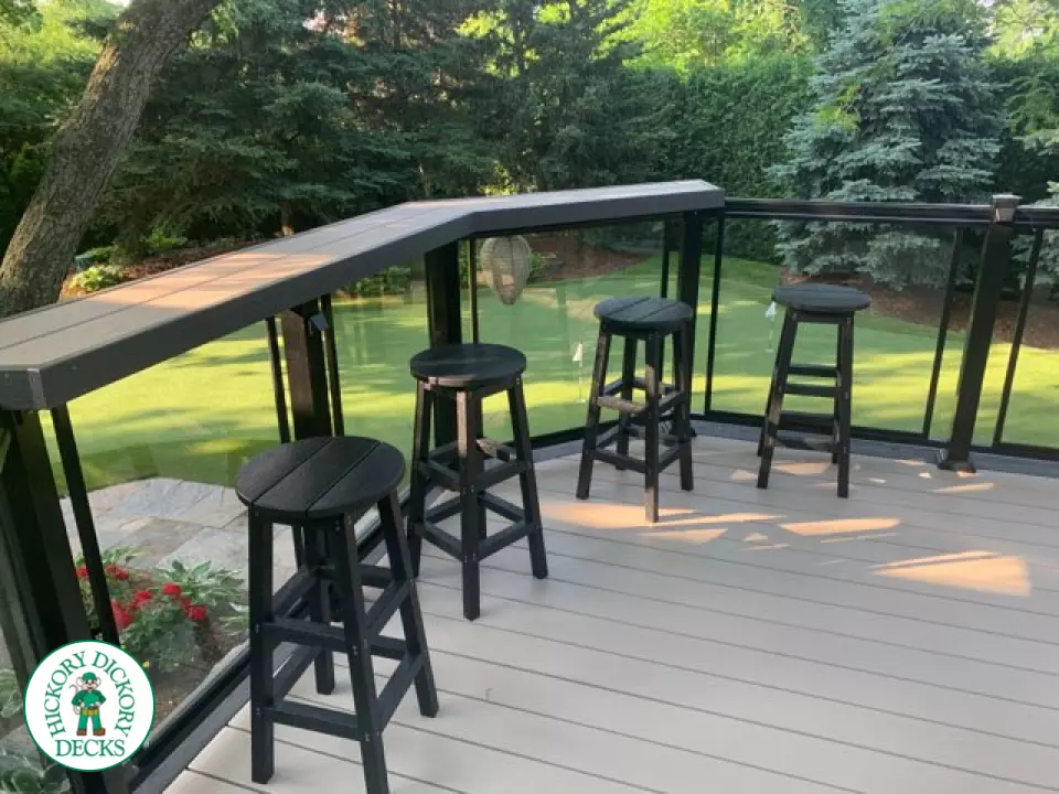 Clubhouse deck in cobblestone with a pavilion, glass railings, lights and a bar seating area, Flamborough, Ontario