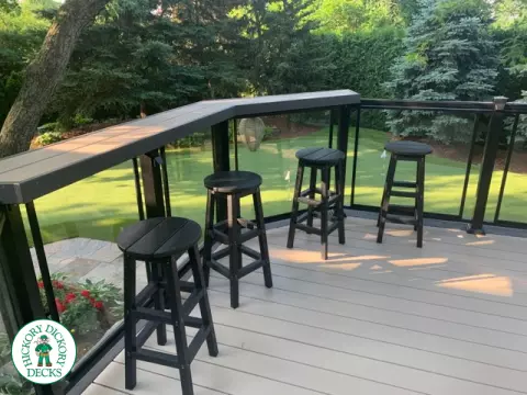 Clubhouse deck in cobblestone with a pavilion, glass railings, lights and a bar seating area, Flamborough, Ontario