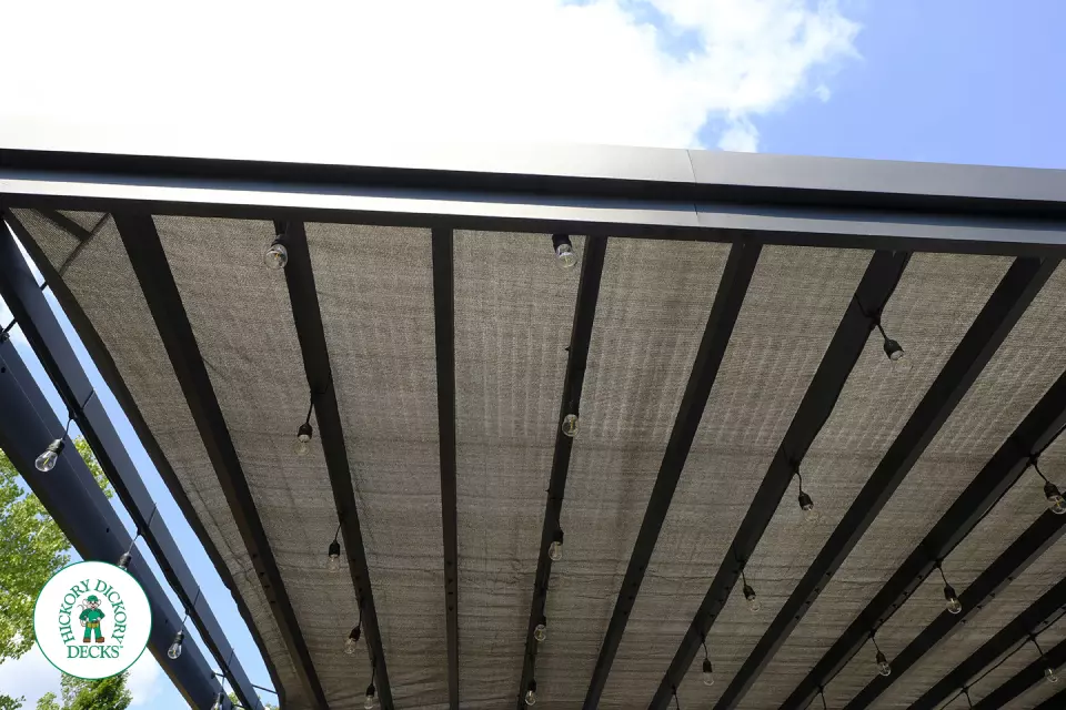 Large grey Fiberon walk out deck with black aluminum railings in Ancaster