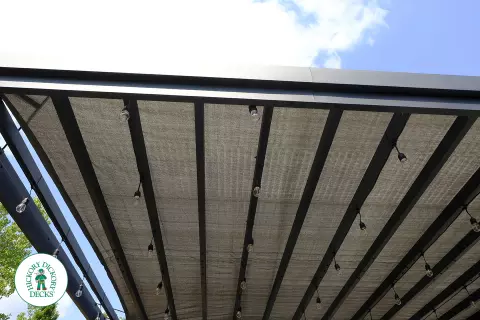 Large grey Fiberon walk out deck with black aluminum railings in Ancaster