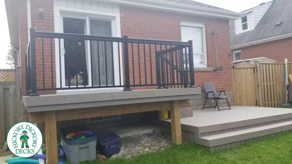 2 level Trunorth composite deck with steps to walk up deck, and wrap around stairs on the bottom level.
