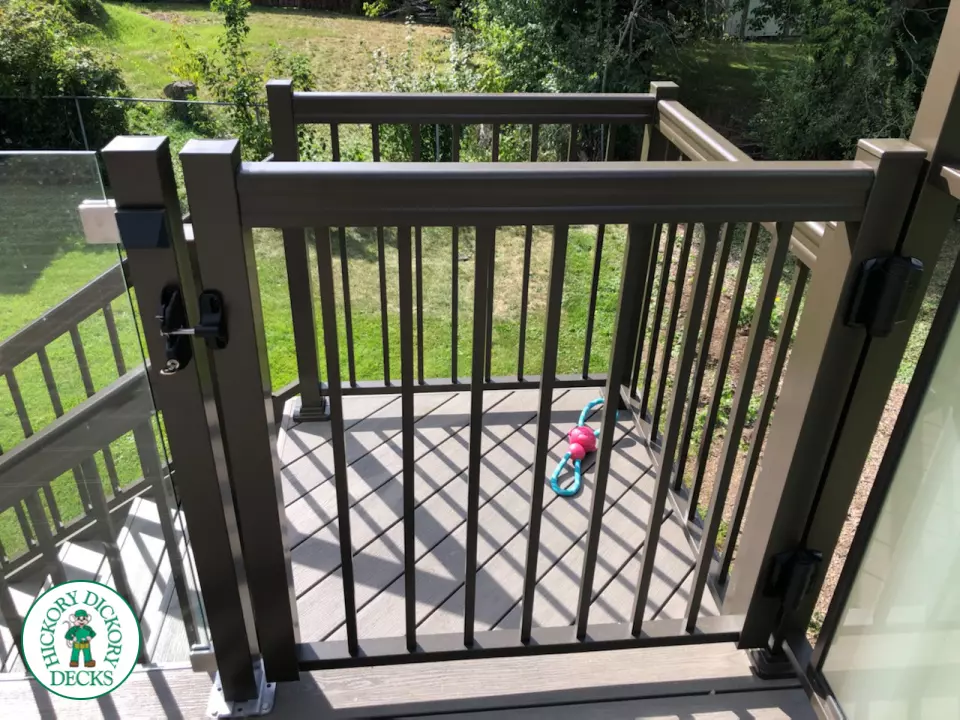 High grey composite deck with glass style railings.