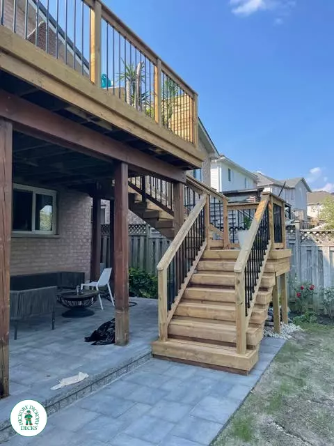 Pressure treated high deck with privacy and stairs in Kitchener