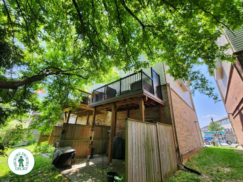 High brown Armadillo balcony with black aluminum railing.