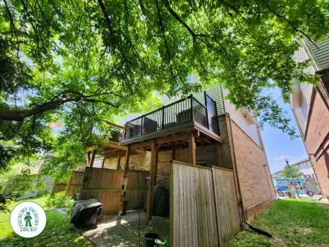 High brown Armadillo balcony with black aluminum railing.