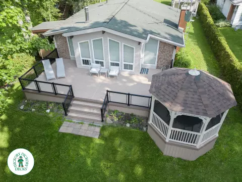 large azek deck with a gazebo and glass rails