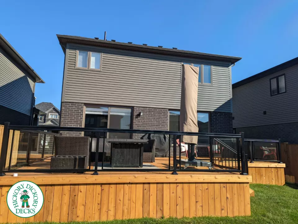 Large cedar deck with stairs, aluminum railing