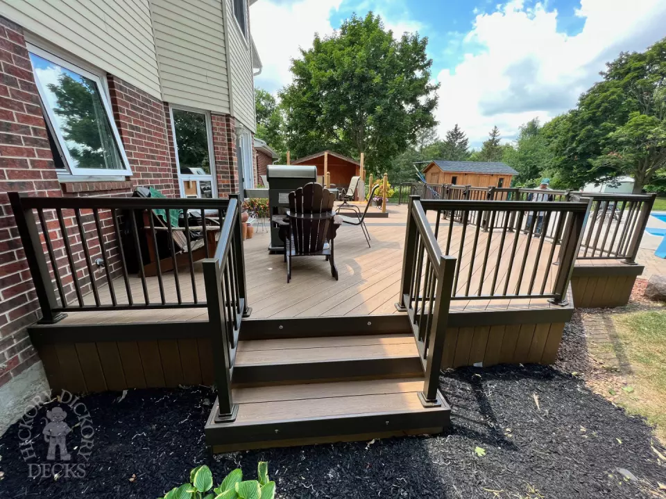 Clubhouse deck with aluminum railing with gate insert for access.
