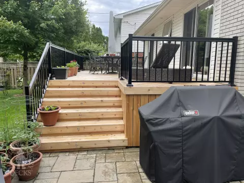 315 square foot cedar deck with lighting system in stairs.