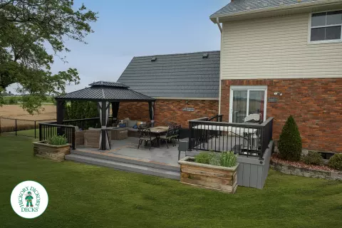 Grey TruNorth deck with brown borders and aluminum railing.