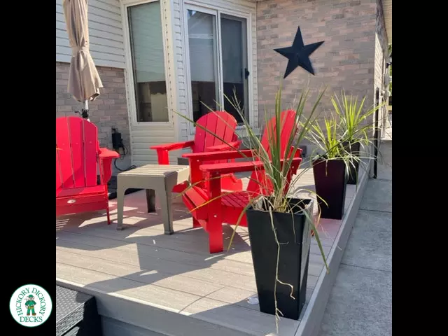 Small grey azek walk out deck with lighting in stairs