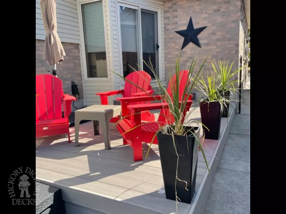 Small grey azek walk out deck with lighting in stairs