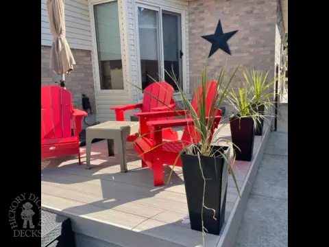 Small grey azek walk out deck with lighting in stairs