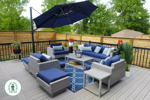 Large grey Fiberon walk out deck with black aluminum railings in Ancaster