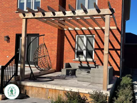 Walkout cedar deck with cedar pergola