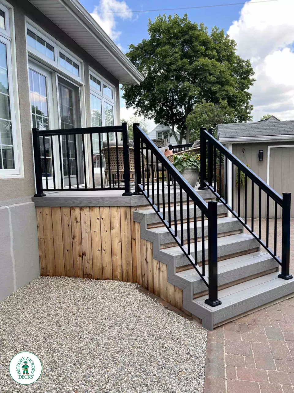 Small grey fiberon deck with black aluminum railing