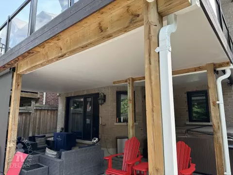 Clubhouse high deck with glass rail and spiral staircase in Newmarket