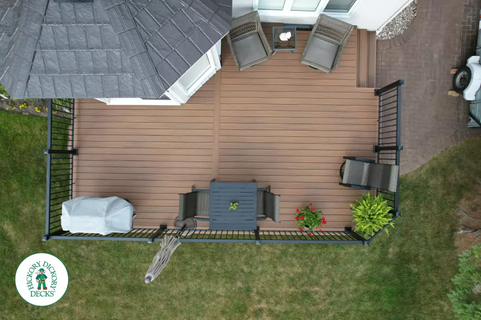 LArge brown fiberon deck with black aluminum railings.