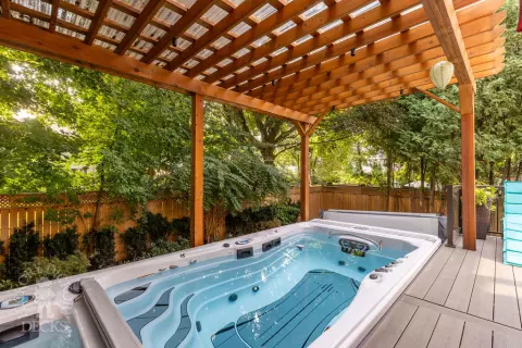 Clubhouse hot tub deck with pergola in North York