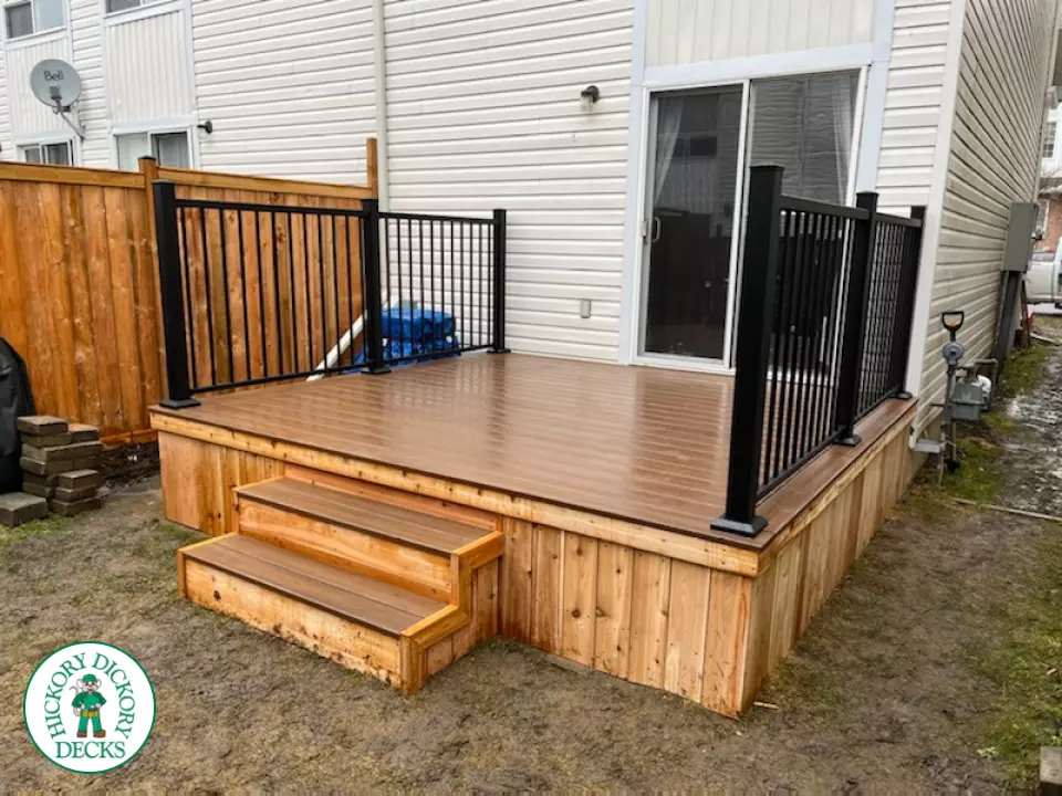 Small brown fiberon deck with black aluminum railing.