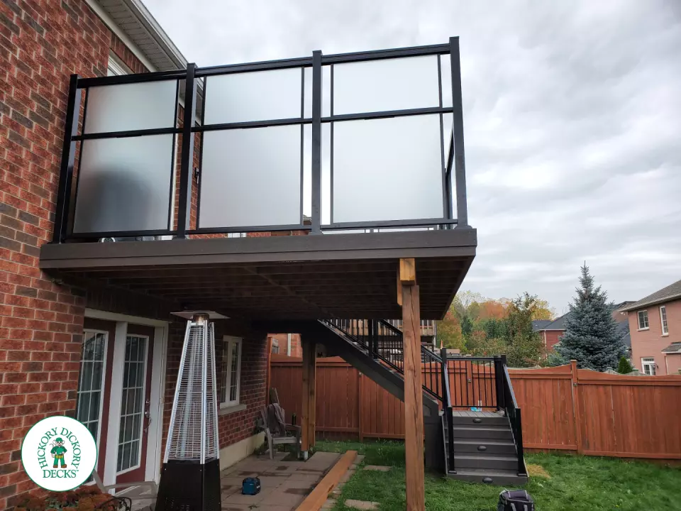 Clubhouse high deck with glass railings and privacy screens in Oshawa