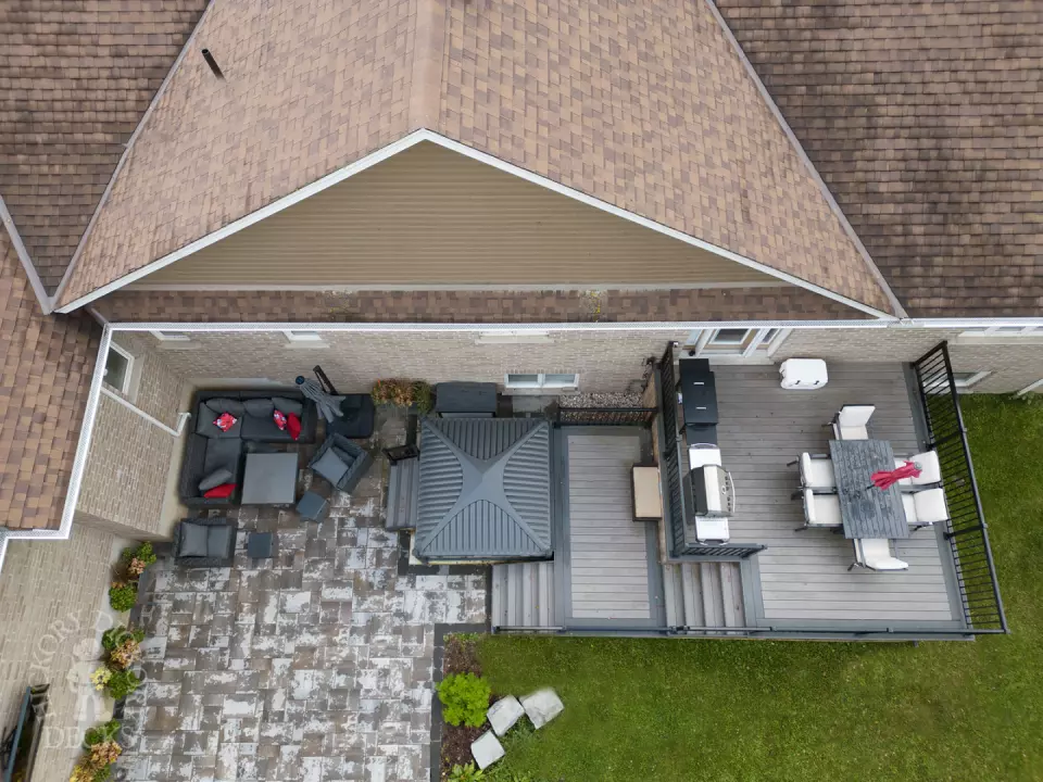 2 level clubhouse deck with cedar skirting, black aluminum railing, and grey color with darker grey border.