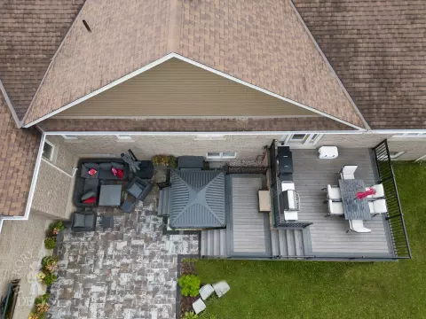 2 level clubhouse deck with cedar skirting, black aluminum railing, and grey color with darker grey border.