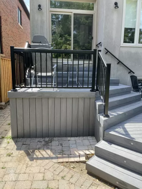 Small multilevel grey deck with lights in steps