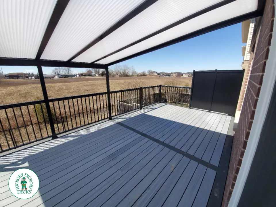 Trex deck with privacy screens and custom roof in Ancaster