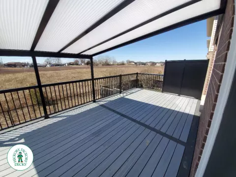 Trex deck with privacy screens and custom roof in Ancaster
