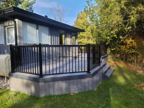 TruNorth deck with aluminum railing and lights in Brampton