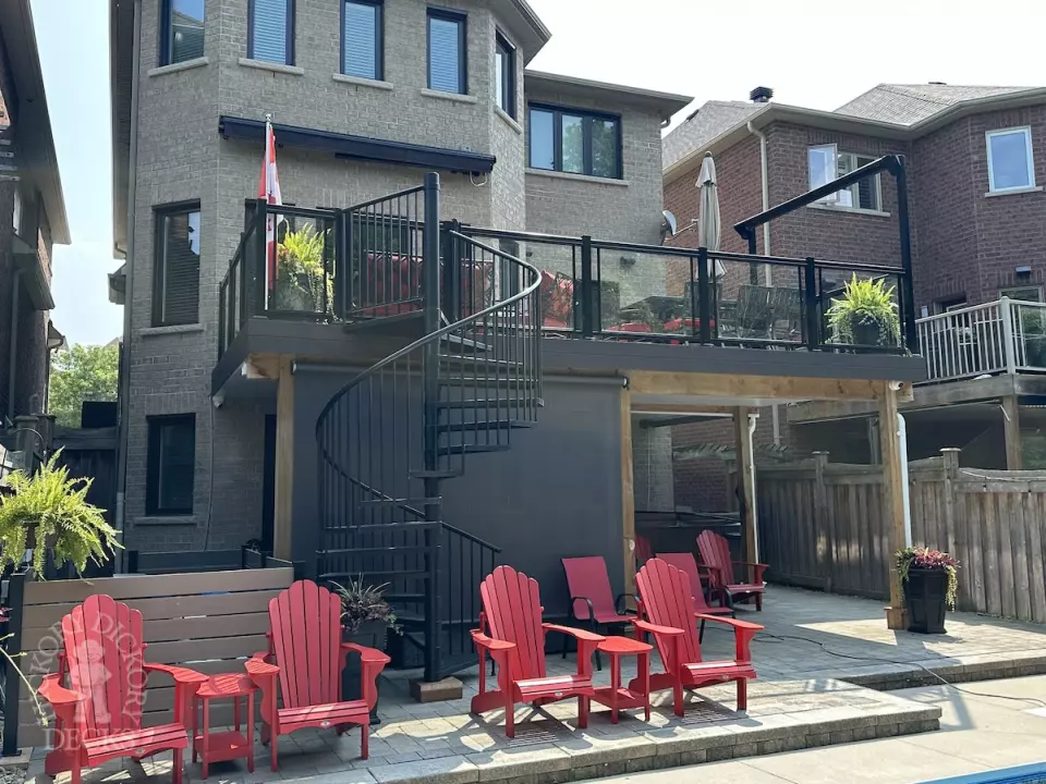 Clubhouse high deck with glass rail and spiral staircase in Newmarket