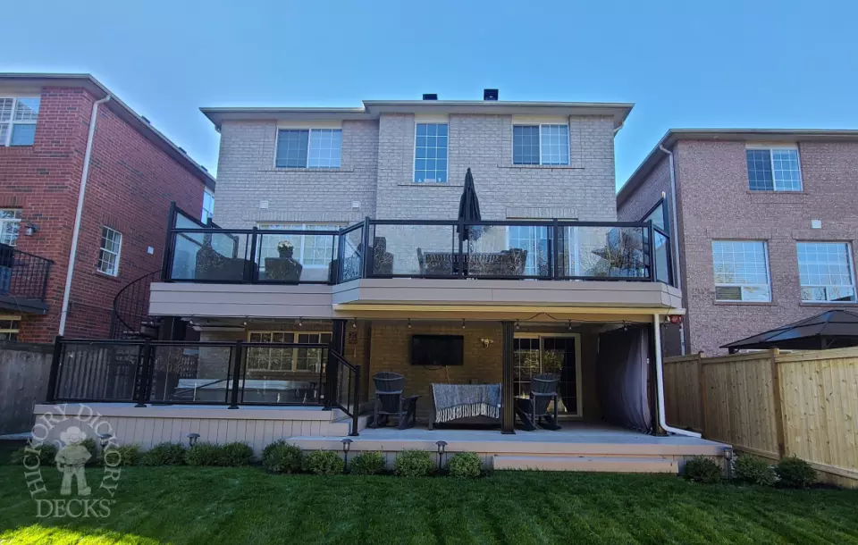 Azek high deck with glass railings and spiral stairs in Brampton